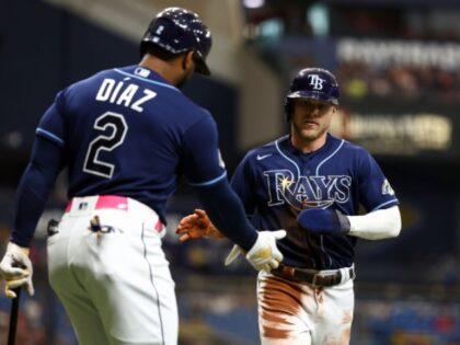 ST PETERSBURG, FL - JULY 5: Taylor Walls #6 of the Tampa Bay Rays high fives Yandy Diaz #2