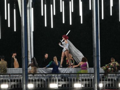 A model presents creations while walking a catwalk erected along the Passerelle Debilly br