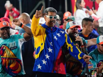 President Nicolas Maduro dances outside the Miraflores presidential palace after electoral