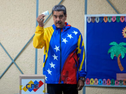 President Nicolas Maduro show his ballot during presidential elections in Caracas, Venezue