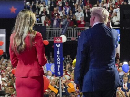 Republican presidential candidate former President Donald Trump stands on stage with forme