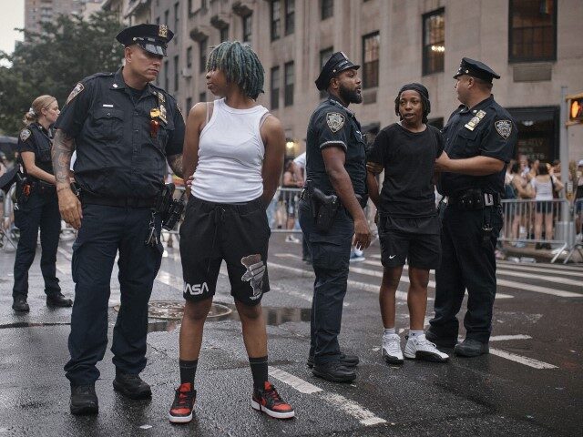 Spectators get arrested after a fight during the NYC Pride March, Sunday, June 30, 2024, i