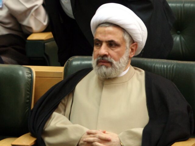 Iranian President Mahmoud Ahmadinejad,left bottom, talks with his top advisor Mojtaba Sama