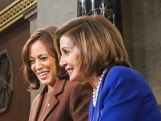 President Joe Biden presents copies of his speech to Vice President Kamala Harris and Hous