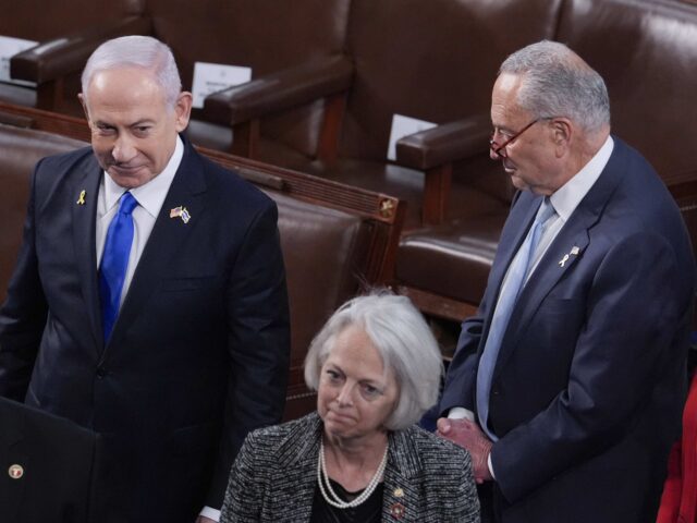 Israeli Prime Minister Benjamin Netanyahu, top left, walks past Senate Majority Leader Chu