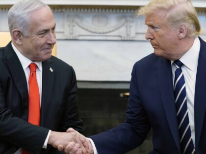 President Donald Trump, right, and Israeli Prime Minister Benjamin Netanyahu shake hands i