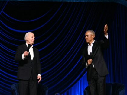 ADDED ON 7/18/24 -- US President Joe Biden (L) stands with former US President Barack Obam