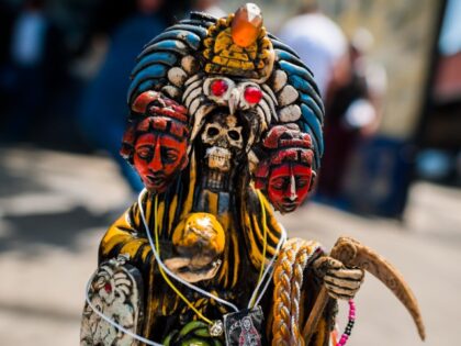 Detail of a Santa Muerte (Holy Death) figurine with Aztec culture features during the reli