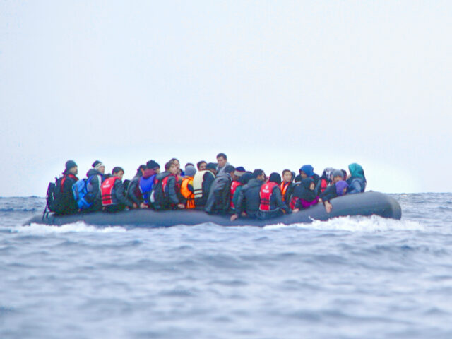 Refugees on a boat crossing the Mediterranean sea, heading from Turkish coast to the north