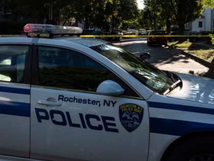 ROCHESTER, NY - SEPTEMBER 19: Police tape lines a crime scene after a shooting at a backya