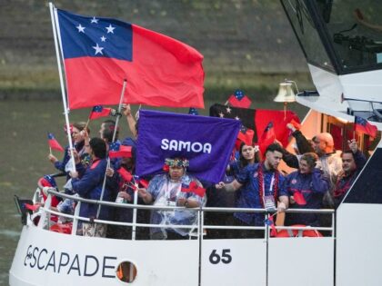 PARIS, FRANCE - JULY 26: Athletes from Samoa delegation sail in a boat along the river Sei