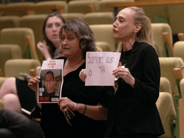 NEW YORK, NEW YORK - JULY 17: Two supporters of Israel holding signs including one of a ho