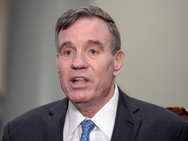 Sen. Mark Warner, D-Va., speaks with reporters on Capitol Hill March 20, 2024, in Washingt