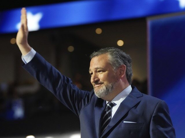 Sen. Ted Cruz, R-Texas, waves during the Republican National Convention Tuesday, July 16,