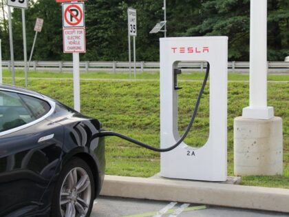 Tesla charging in parking lot