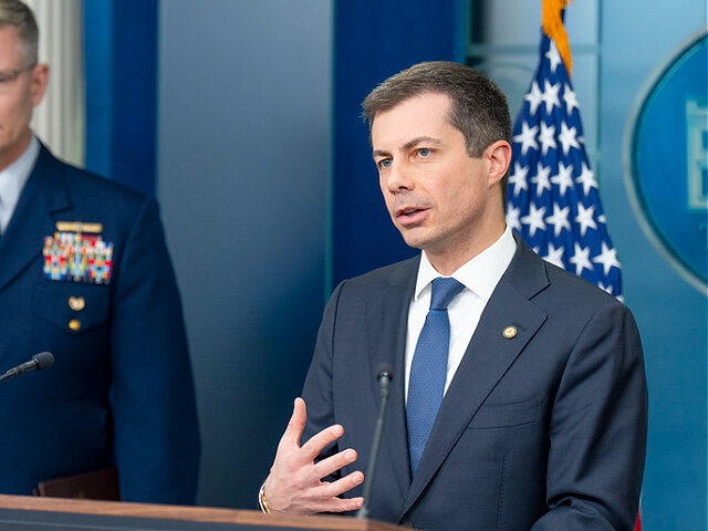 Walz - Transportation Secretary Pete Buttigieg speaks alongside Deputy Commandant for Oper