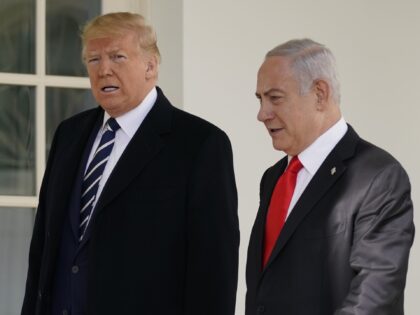 President Donald Trump and Israeli Prime Minister Benjamin Netanyahu walk to a meeting in