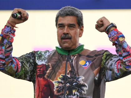 Venezuelan President Nicolas Maduro gestures to supporters as he speaks during a campaign