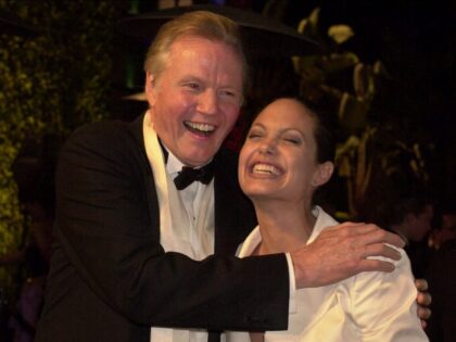 Jon Voight and his daughter Angelina Jolie laugh at the Vanity Fair Oscar party at Morton&