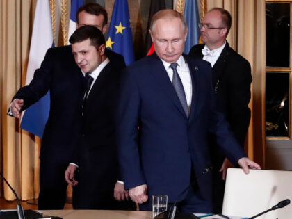 Russian President Vladimir Putin, right, and Ukrainian President Volodymyr Zelenskiy arriv