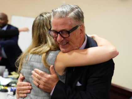 SANTA FE, NEW MEXICO - JULY 12: Alec Baldwin hugs a member of his legal team at the conclu