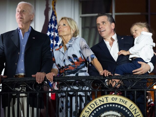 US President Joe Biden, First Lady Jill Biden and Hunter Biden with his son Beau watch the