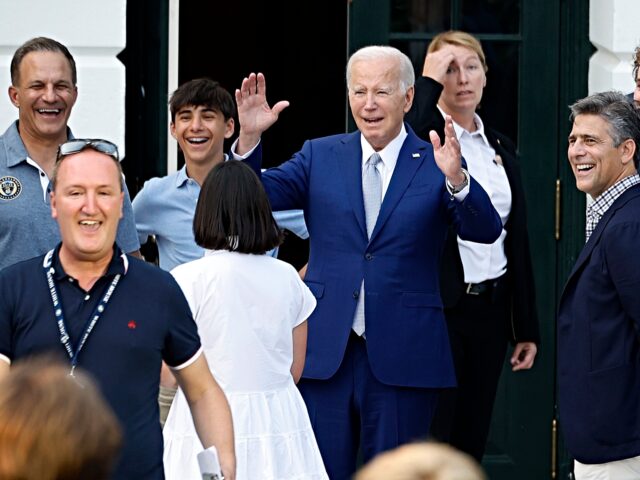 WASHINGTON, DC - JULY 17: U.S. President Joe Biden waves to athletes as he, Philadelphia U