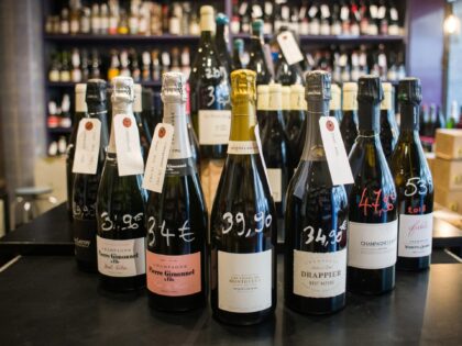 Bottles of champagne on display at the La Cave Le Verre Vole wine store in Paris, France,