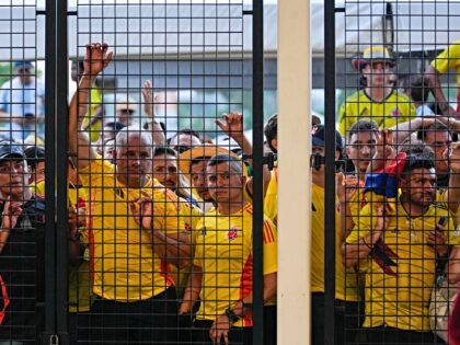 Fans wait to enter the stadium prior to the Copa America final soccer match between Argent