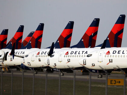 In this April 1, 2020, file photo, several dozen Delta Air Lines jets are parked at Kansas
