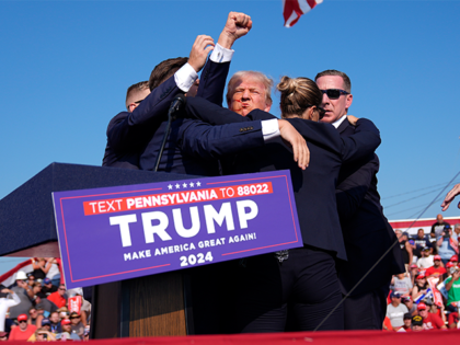 Republican presidential candidate former President Donald Trump is surrounded by U.S. Secr