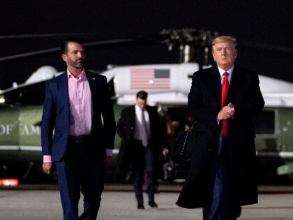 President Donald J. Trump walks with Presidential Advisor Ivanka Trump and his son Donald