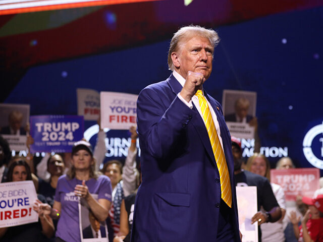 Former President of the United States Donald Trump speaking with attendees at a "Chase the