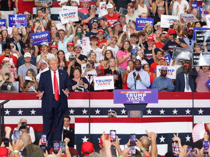 Former US President and 2024 Republican presidential candidate Donald Trump gestures on st