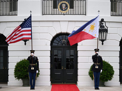 US Marines hold the US and Filipino flags before President Joe Biden and First Lady Jill B