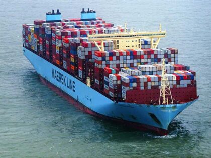 The 'Mumbai Maersk' lies surrounded by tugs in the North Sea near the island of Wangerooge