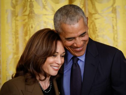 WASHINGTON, DC - APRIL 5: Former President Barack Obama hugs Vice President Kamala Harris