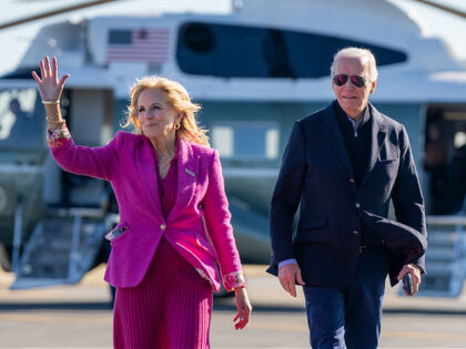 President Joe Biden and First Lady Jill Biden wave to the press after they disembark Marin