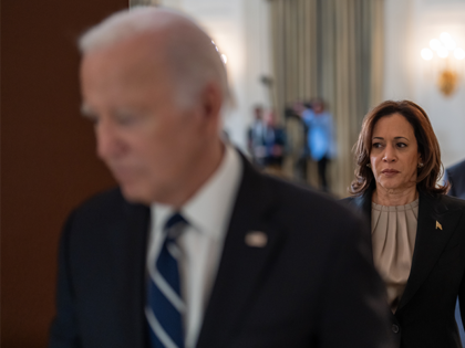 Vice President Kamala Harris walks behind President Joe Biden on October 10, 2023, in the