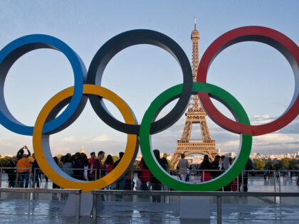 FILE - The Olympic rings are set up at Trocadero plaza that overlooks the Eiffel Tower in
