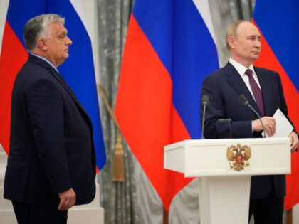 Russian President Vladimir Putin, right, and Hungarian Prime Minister Viktor Orban attend