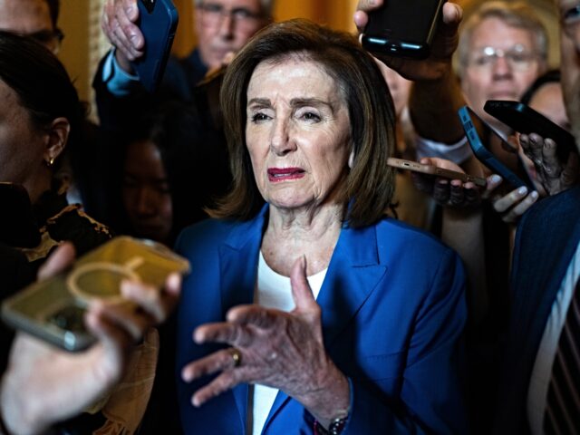 UNITED STATES - JUNE 28: Rep. Nancy Pelosi, D-Calif., talks with reporters in the U.S. Cap