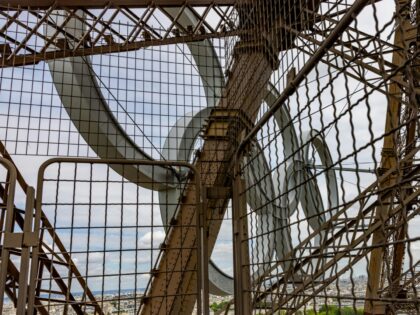 A unique perspective from within the Eiffel Tower, looking up at its intricate metallic st