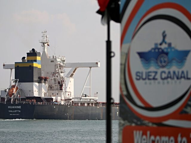 FILE - A cargo ship sails through the town of Ismailia, Egypt, March 30, 2021. Houthi rebe