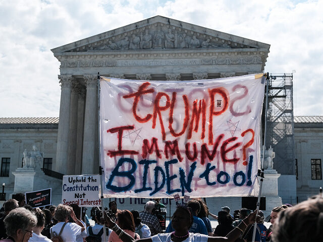 WASHINGTON, DC - JUNE 28: Demonstrators gather outside of the U.S. Supreme Court as opinio
