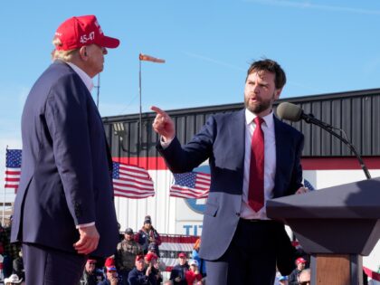 FILE - Sen. J.D. Vance, R-Ohio, right, points toward Republican presidential candidate for