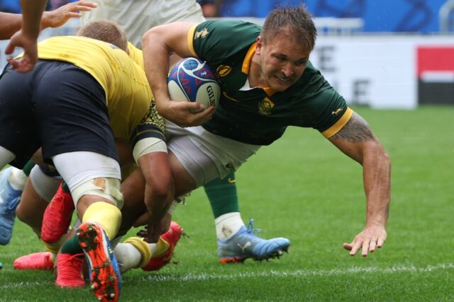 Andre Esterhuizen (R) playing for South Africa against Romania in the 2023 Rugby World Cup