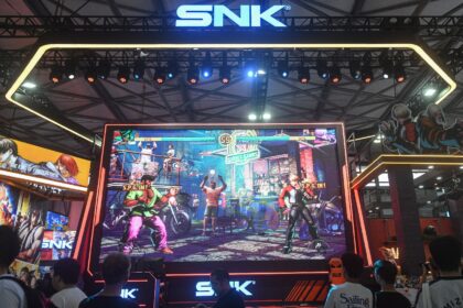 Attendees visit the booth of Japanese video game company SNK at the annual ChinaJoy digita