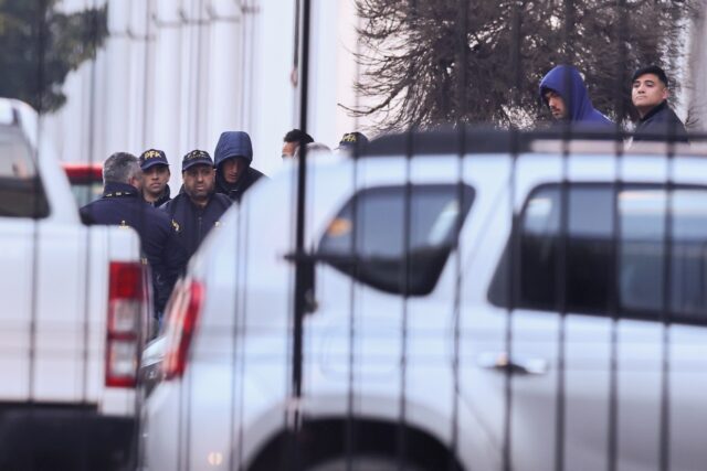 French national rugby players Hugo Auradou (2nd R) and Oscar Jegou (4th L) are escorted by