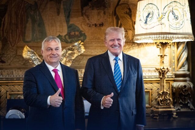 Hungary's Prime Minister Viktor Orban (L) poses with former US president Donald Trump at T